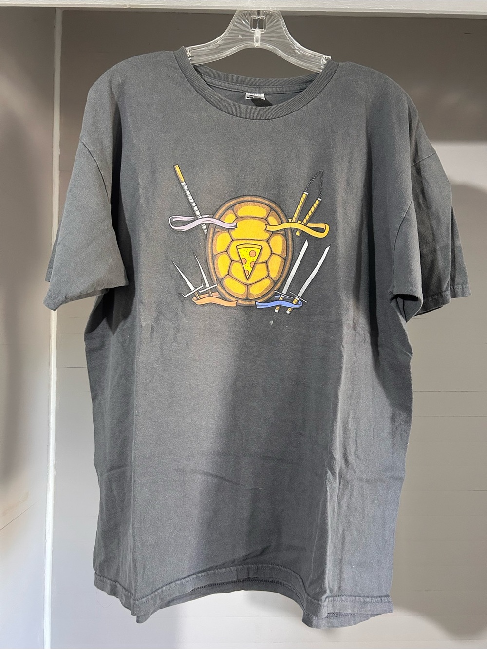 Men's Black Short-Sleeve Graphic Tee with Yellow Turtle Emblem